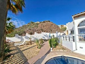 a house with a swimming pool and a mountain at Casa Mar II in Águilas +38 photos