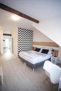 Postel nebo postele na pokoji v ubytování Haas Apartments