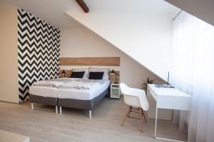 Posteľ alebo postele v izbe v ubytovaní Haas Apartments