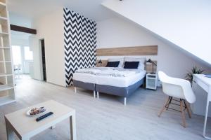 Posteľ alebo postele v izbe v ubytovaní Haas Apartments