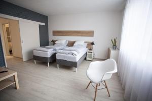Posteľ alebo postele v izbe v ubytovaní Haas Apartments