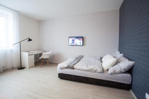 Televízia a/alebo spoločenská miestnosť v ubytovaní Haas Apartments