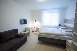 Posteľ alebo postele v izbe v ubytovaní Haas Apartments