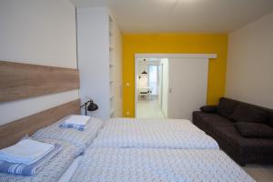 Posteľ alebo postele v izbe v ubytovaní Haas Apartments