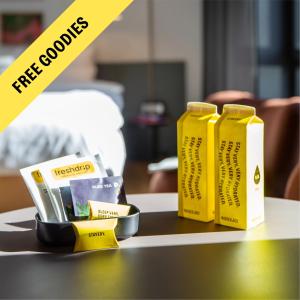 a table with two yellow boxes on top of it at STAYERY Wolfsburg - VW Tor 17 in Wolfsburg