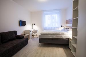 Posteľ alebo postele v izbe v ubytovaní Haas Apartments