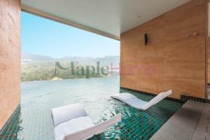 a room with a view of the water at Antharas 1 Premier Suites Genting Highlands in Genting Highlands
