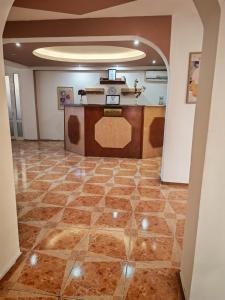 an empty room with a counter in the middle of a room at Vila njoy by the sea in Eforie Sud