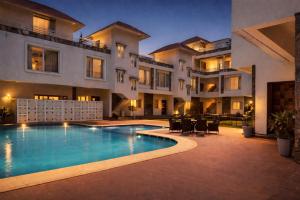 a swimming pool in front of a building at Devi Palace - Monsoon Palace View Resort, Udaipur in Udaipur +33 photos