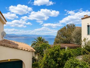 a view of the ocean from a house at ALIO Seaside Maisonette, Steps from Diakopto Beach in Diakopto