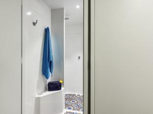 a glass door leading into a bathroom with a towel at Hotel F1 Maurepas in Maurepas +44 photos