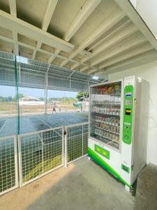 a vending machine with drinks inside of a building at Fairway Grove at Iba, Zambales in Dirita