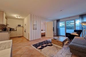 a living room with a couch and a table at Ferienwohnung Graugans in Baabe