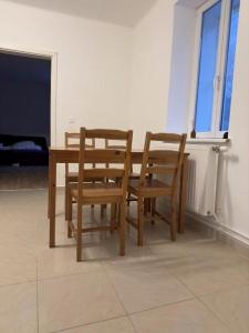 a wooden table and chairs in a room at Ferienwohnung in Reichenau an der Rax in Reichenau