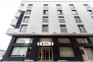 a white building with a sign on it at Perla Arya Hotel in Izmir