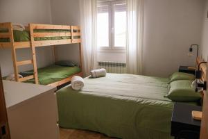 a bedroom with two bunk beds and a window at Finca cataleya in Noez +43 photos