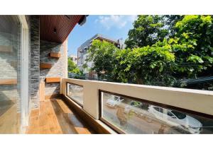 a balcony with a view of a building at Olive Serviced Apartments - Central Delhi in New Delhi