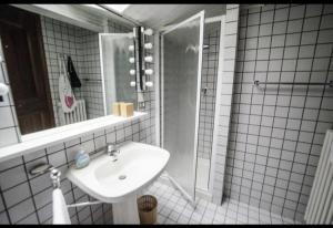 a white bathroom with a sink and a shower at Villa Ca' dei Tigli in Porretta Terme +10 photos