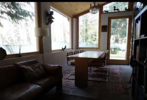 a living room with a table and a couch at Villa Ca' dei Tigli in Porretta Terme