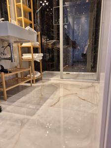 a bathroom with a marble floor and a sink at Apartment Nähe Zentrum in Vienna +34 photos
