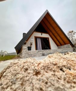a pile of dirt in front of a small house at Vikendica Golubicanka in Bihać