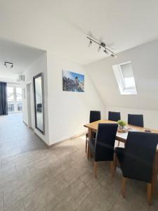 a dining room with a table and chairs at Apartment - Pension Marianna in Rust