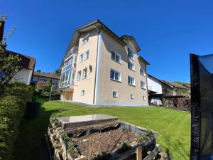 a large building with a garden in front of it at Ferienwohnung unterm Äpflet in Furth im Wald