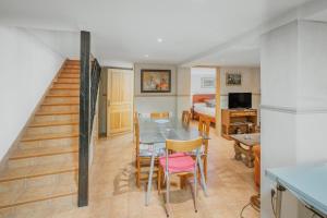 a living room with a table and a bedroom at Casa Romo 1 in Chavida