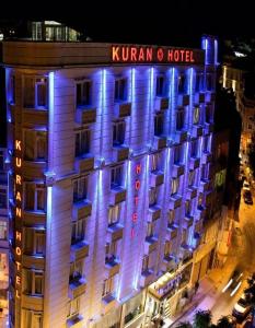 a hotel with blue lights on the side of a building at Kuran Hotel International in Istanbul