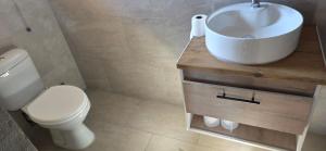 a bathroom with a toilet and a sink at Mooring Manor Chalet in Vaal Marina