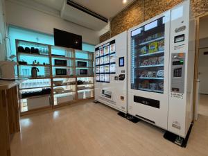 a store with refrigerators and shelves of food at Rich Reson Ishigaki in Ishigaki Island