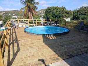a large swimming pool on a wooden deck at jackys culebra apartment in Culebra
