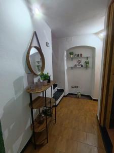 a dressing room with a mirror and a table at Barrique in Villa Viani