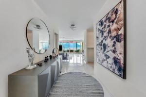 a bathroom with a large mirror on the wall at Spacious 3BR Lakeview Apartment with Terrace by GuestLee in Montreux