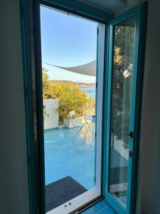 a sliding glass door with a view of a patio at Villa Tre Mari in Villasimius