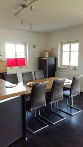 a conference room with a wooden table and chairs at Ferienhaus Sonnenpier in Putbus