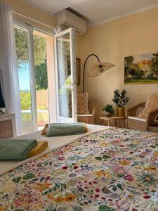 a bedroom with a large bed with a colorful bedspread at Pitch Provence B&B in Ollioules +41 photos