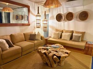 a living room with a couch and a coffee table at Surfers Spot in Ponta do Ouro