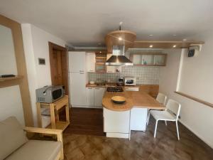 a kitchen with a wooden counter top in a room at Calle del Palazzo 12 in Grado