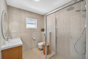 a bathroom with a shower and a toilet and a sink at Spacious Villa Victoria Heated Pool in Callao Salvaje +37 photos
