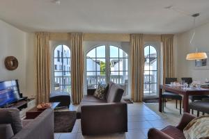 a living room with a couch and a table at Gesine 4 Mare Baltic in Nienhagen