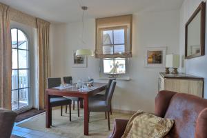 a living room with a table and chairs at Gesine 4 Mare Baltic in Nienhagen