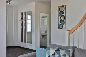 a living room with a couch and a sink at FH Wiesenkieker in Güstow +21 photos