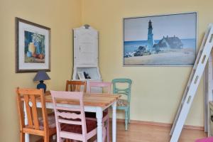 a dining room with a table and chairs at Herrenhaus Blengow App.18 in Blengow