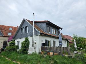 a white house with a black roof at Wittenburg Perdöhl 2 in Wittenburg