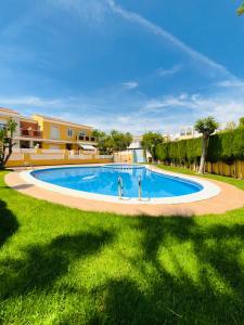 a swimming pool in the middle of a yard at Costa Norte in Alcalà de Xivert