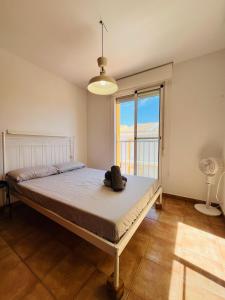a bedroom with a bed with a hat on it at Costa Norte in Alcalà de Xivert +34 photos