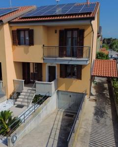 a house with solar panels on the roof at Renée Guest House in Paestum