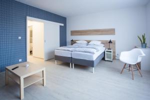 Posteľ alebo postele v izbe v ubytovaní Haas Apartments