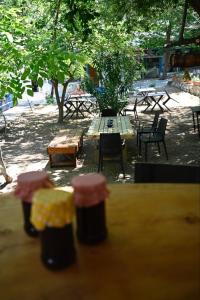 a view of a picnic table with tables and chairs at Kalemi Pansiyon in Marmara